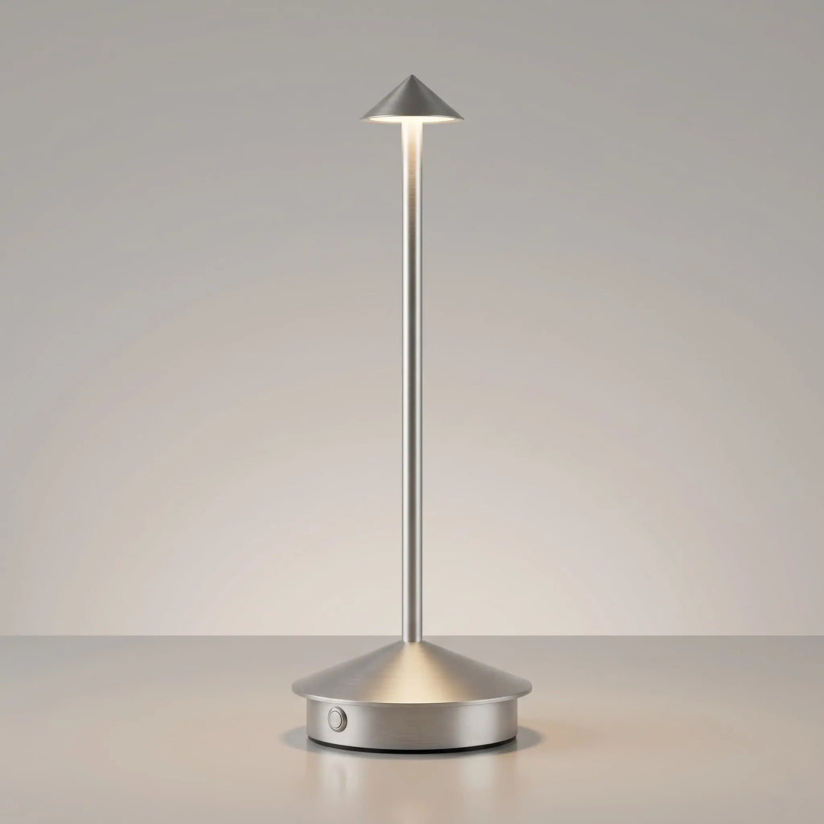 Aesthix Lume Vela slim rechargeable lamp in silver finish on plain background