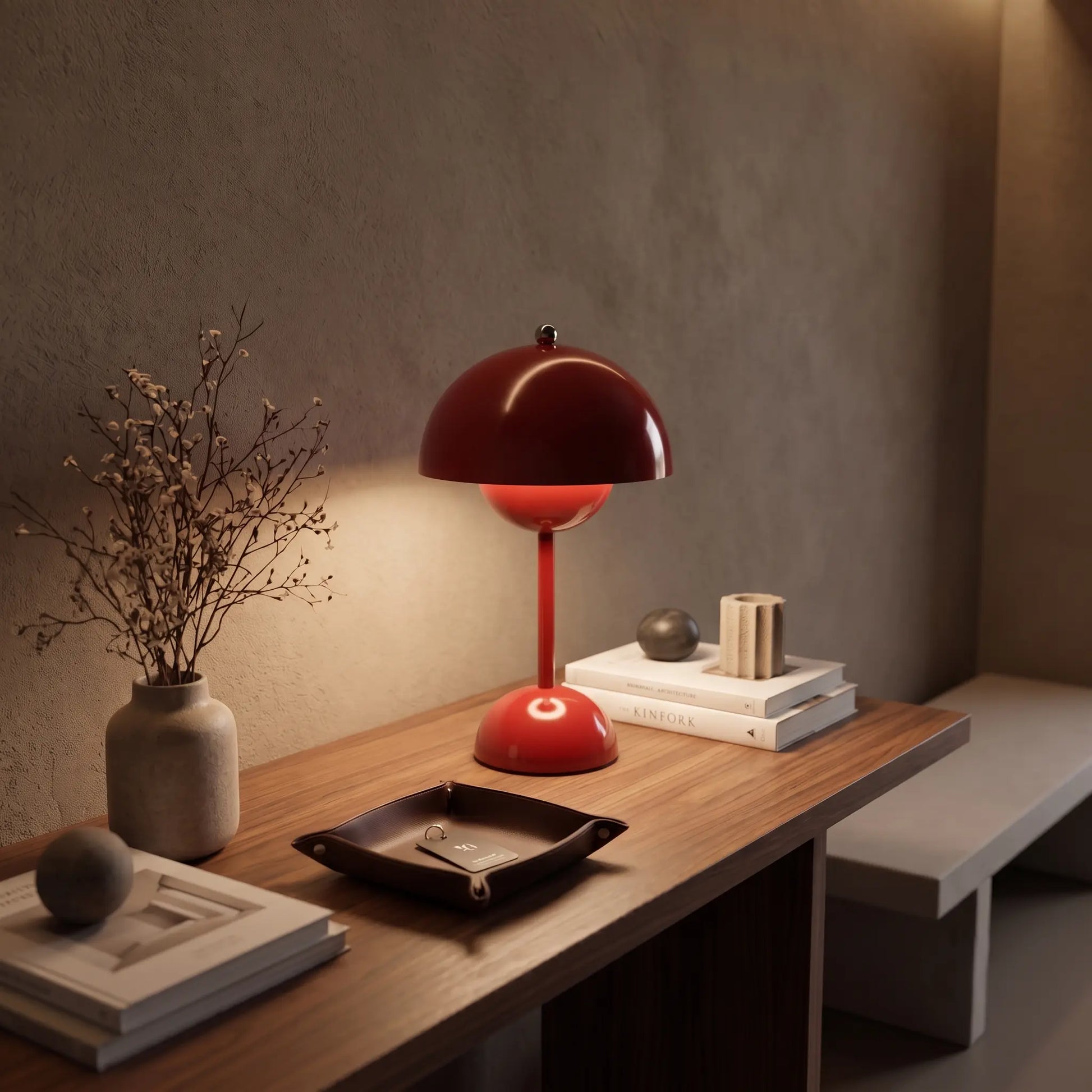 Aesthix Lume Bud red retro table lamp on a wooden console with books and dried flowers
