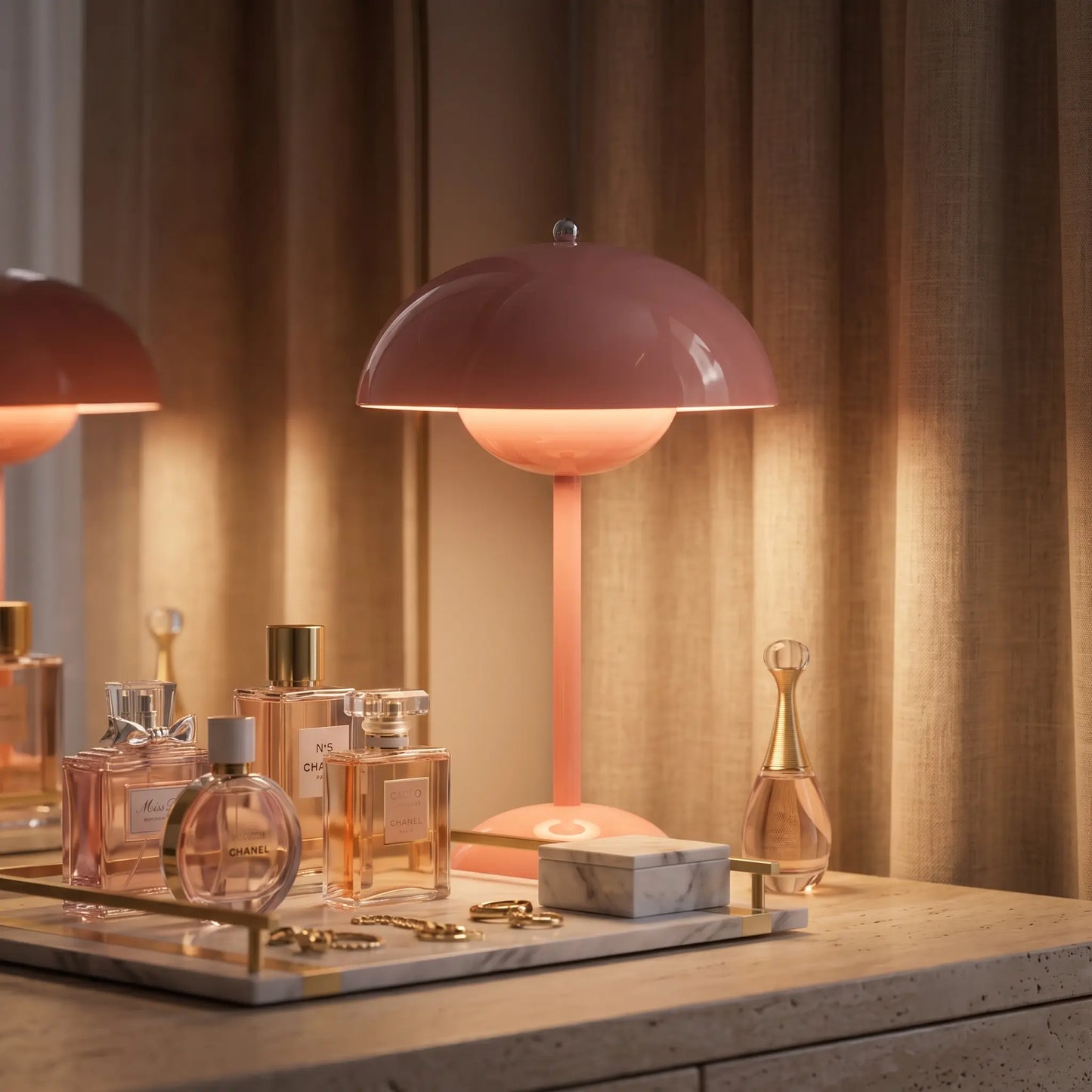 Aesthix Lume Bud pink retro table lamp displayed on a vanity with perfume bottles