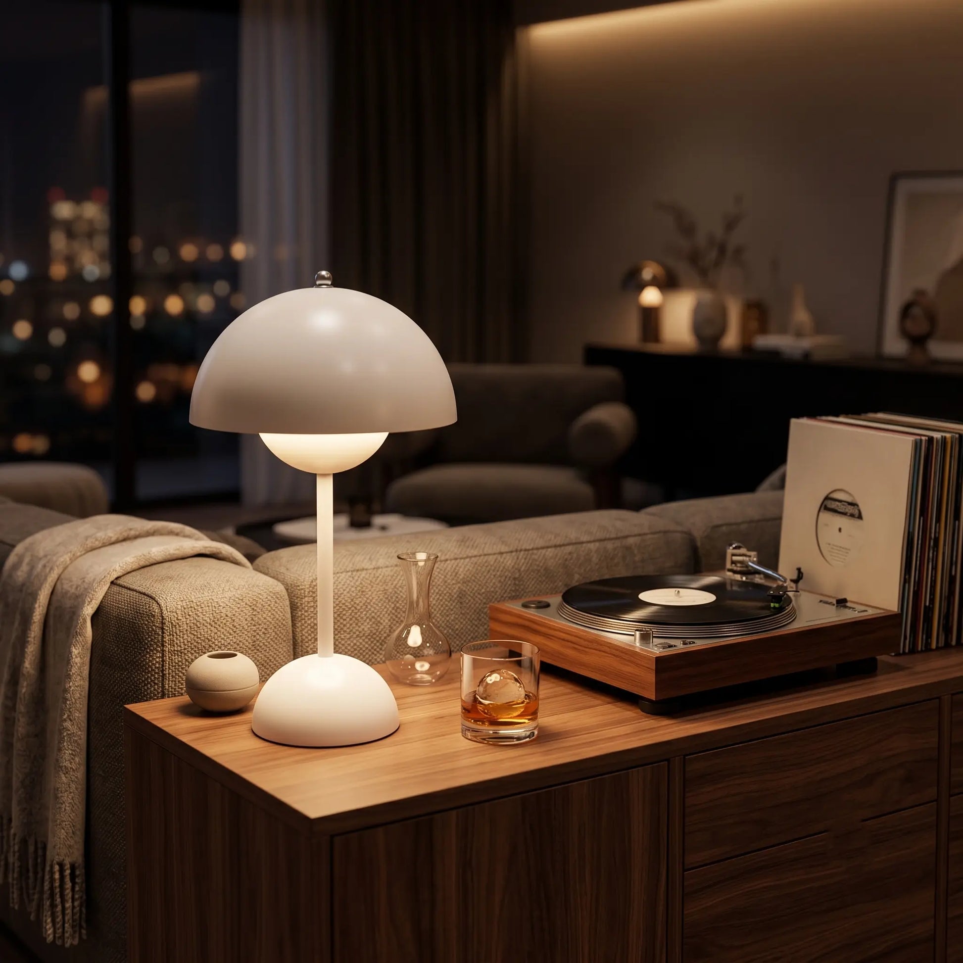  Aesthix Lume Bud white retro table lamp glowing on a bedside table in a cosy drawing room