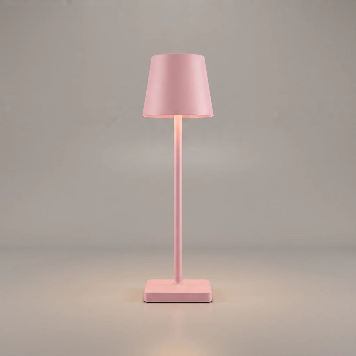 Aesthix Lume Classic bar style touch table lamp in pink finish on plain background