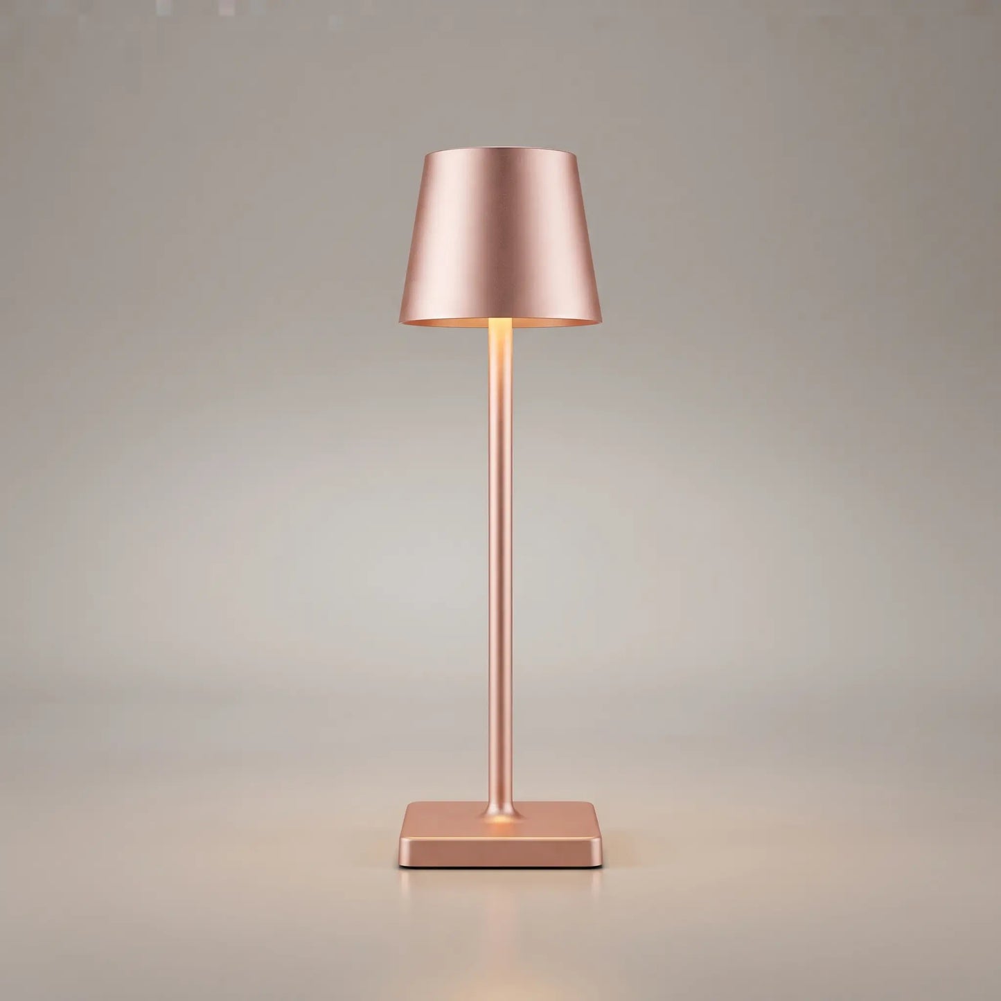 Aesthix Lume Classic bar style touch table lamp in rose finish on plain background