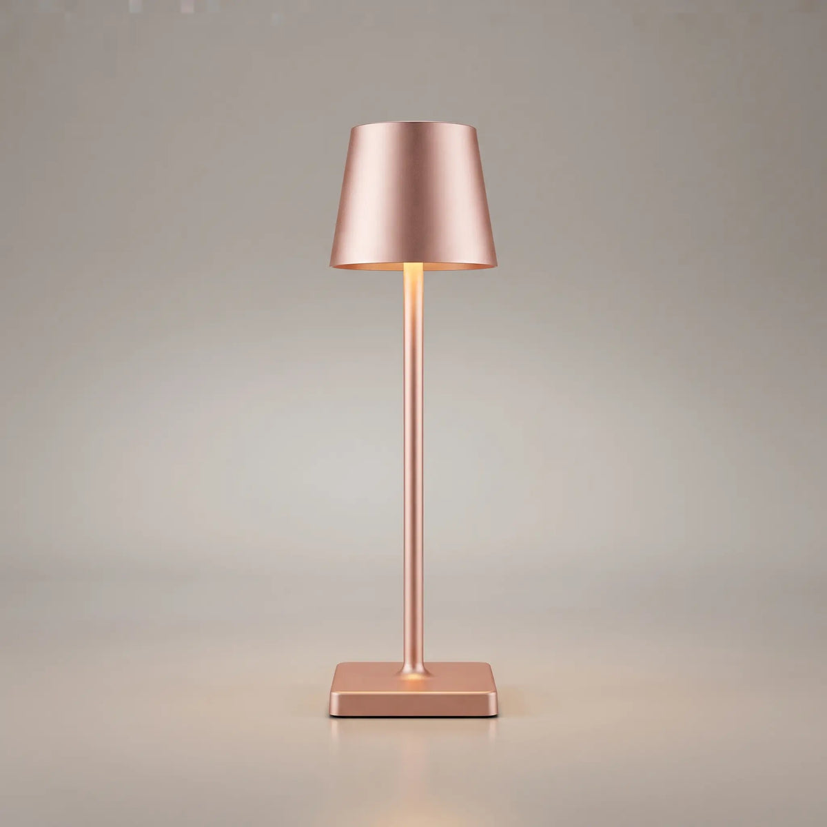 Aesthix Lume Classic bar style touch table lamp in rose finish on plain background