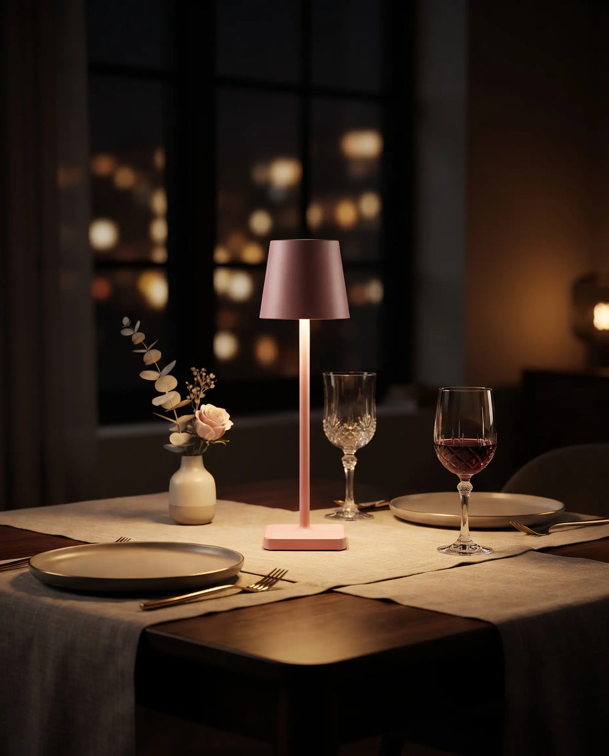 Aesthix Lume Classic blue bar style touch table lamp glowing on a dinner table with wine glasses at night