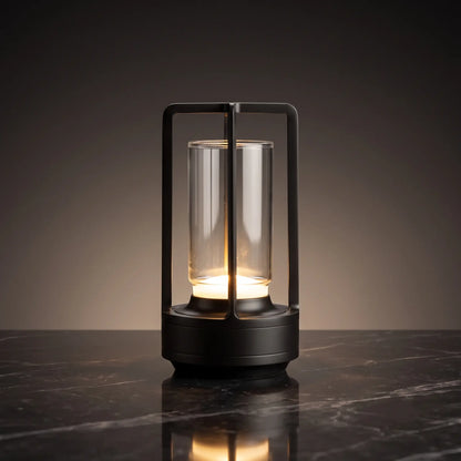 Aesthix Lume Luxe glass lantern table lamp in black finish on a dark marble background