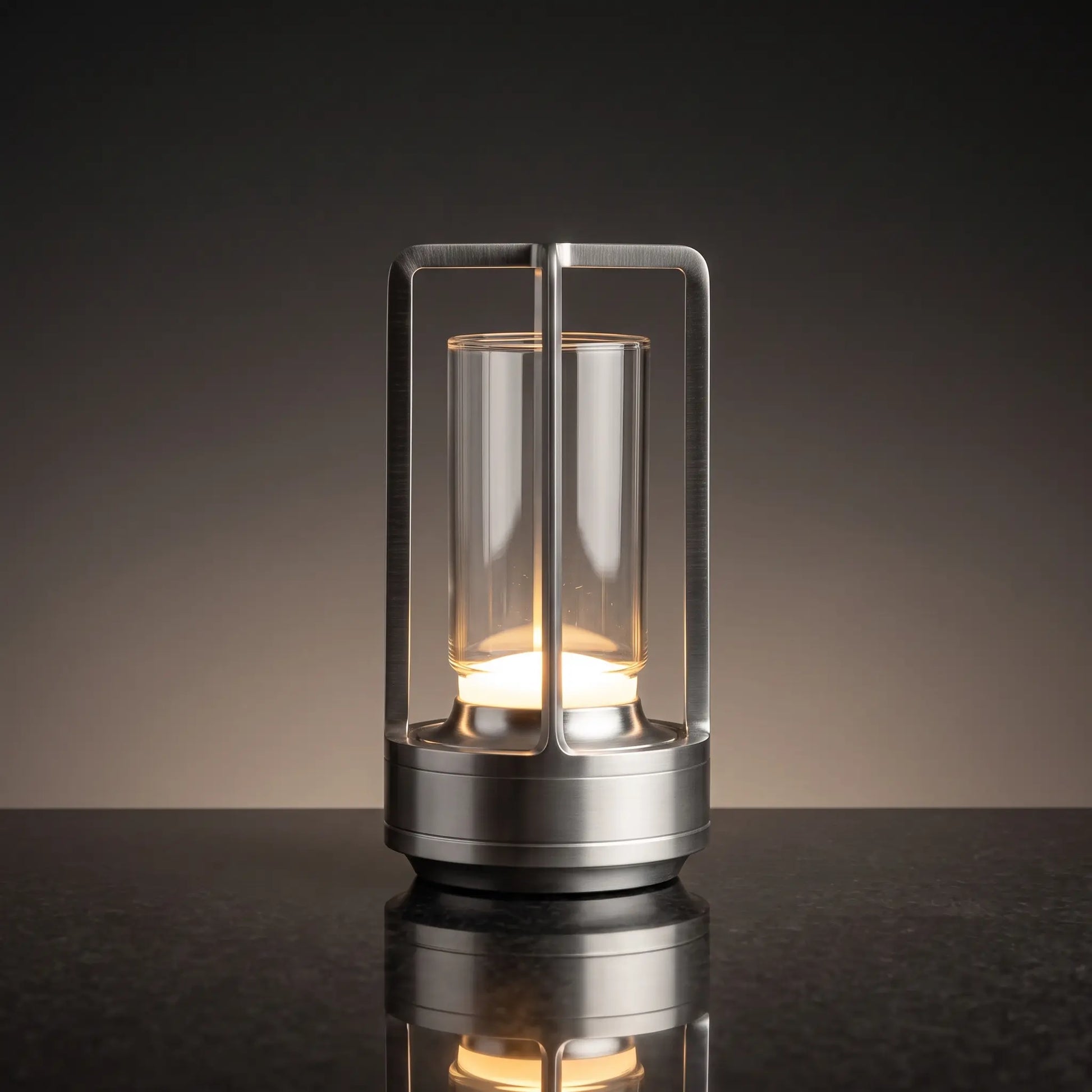 Aesthix Lume Luxe glass lantern table lamp in silver finish on a dark marble background