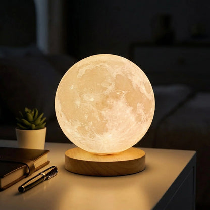 Aesthix Lume Luna moon lamp warm yellow close-up wooden base desk plant beside UK