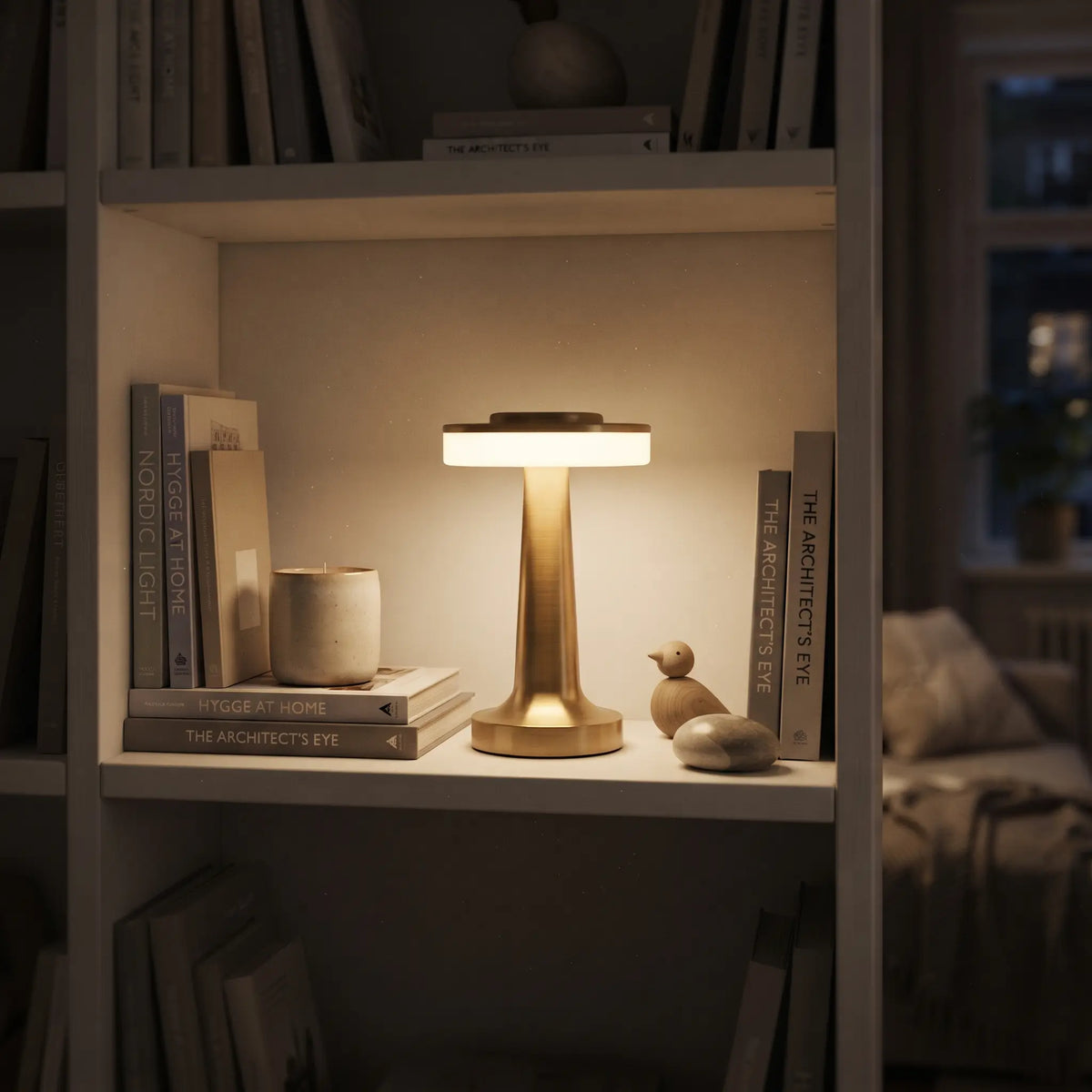 Aesthix Lume Nova cordless touch table lamp gold finish bookshelf hygge books candle wooden bird figurine warm glow UK