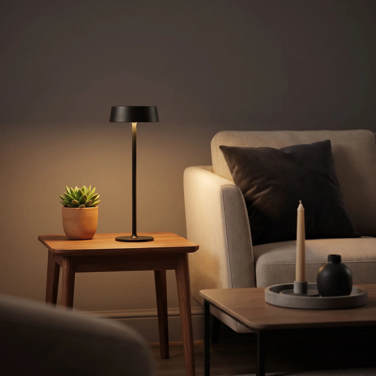Aesthix Lume Plate white Nordic touch table lamp on a side table beside a cosy armchair