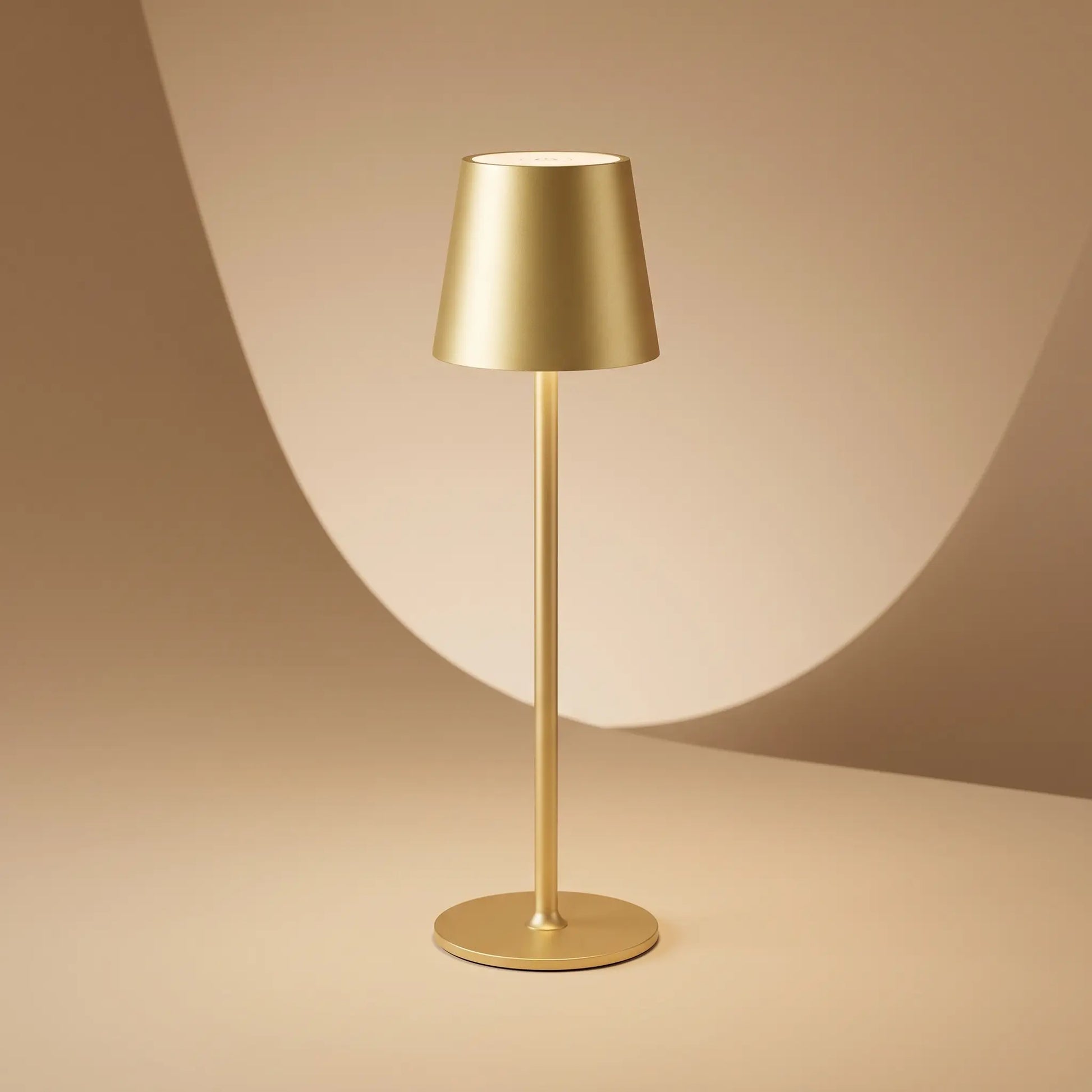 Aesthix Lume Poise rechargeable waterproof table lamp gold finish product shot luxury  studio background UK