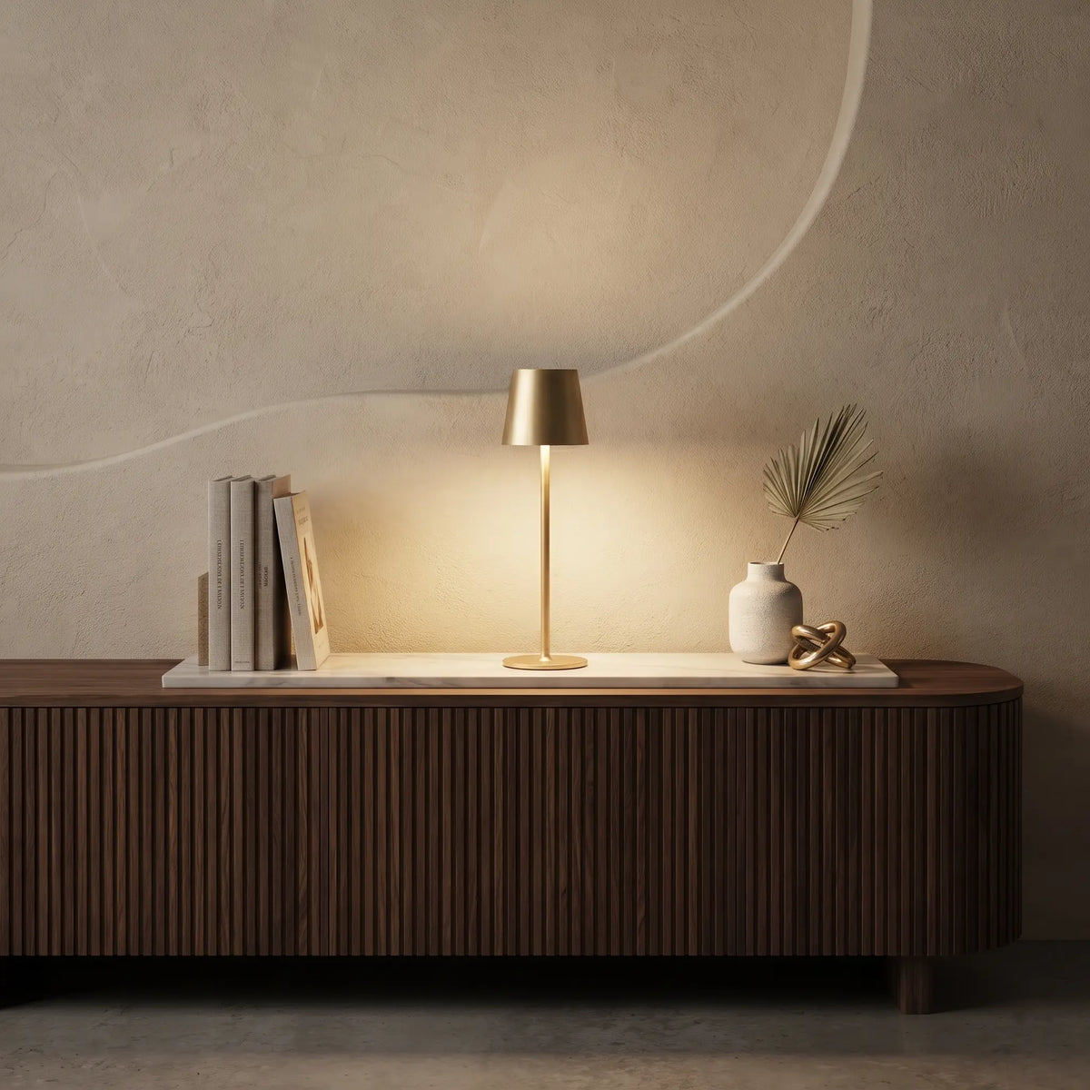 Aesthix Lume Poise rechargeable waterproof table lamp gold finish wooden sideboard books vase warm ambient light UK