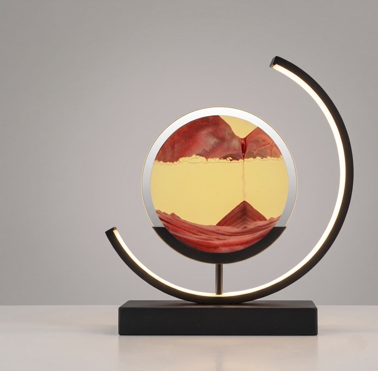 Aesthix Lume Drift quicksand art lamp orange yellow sand black base product shot