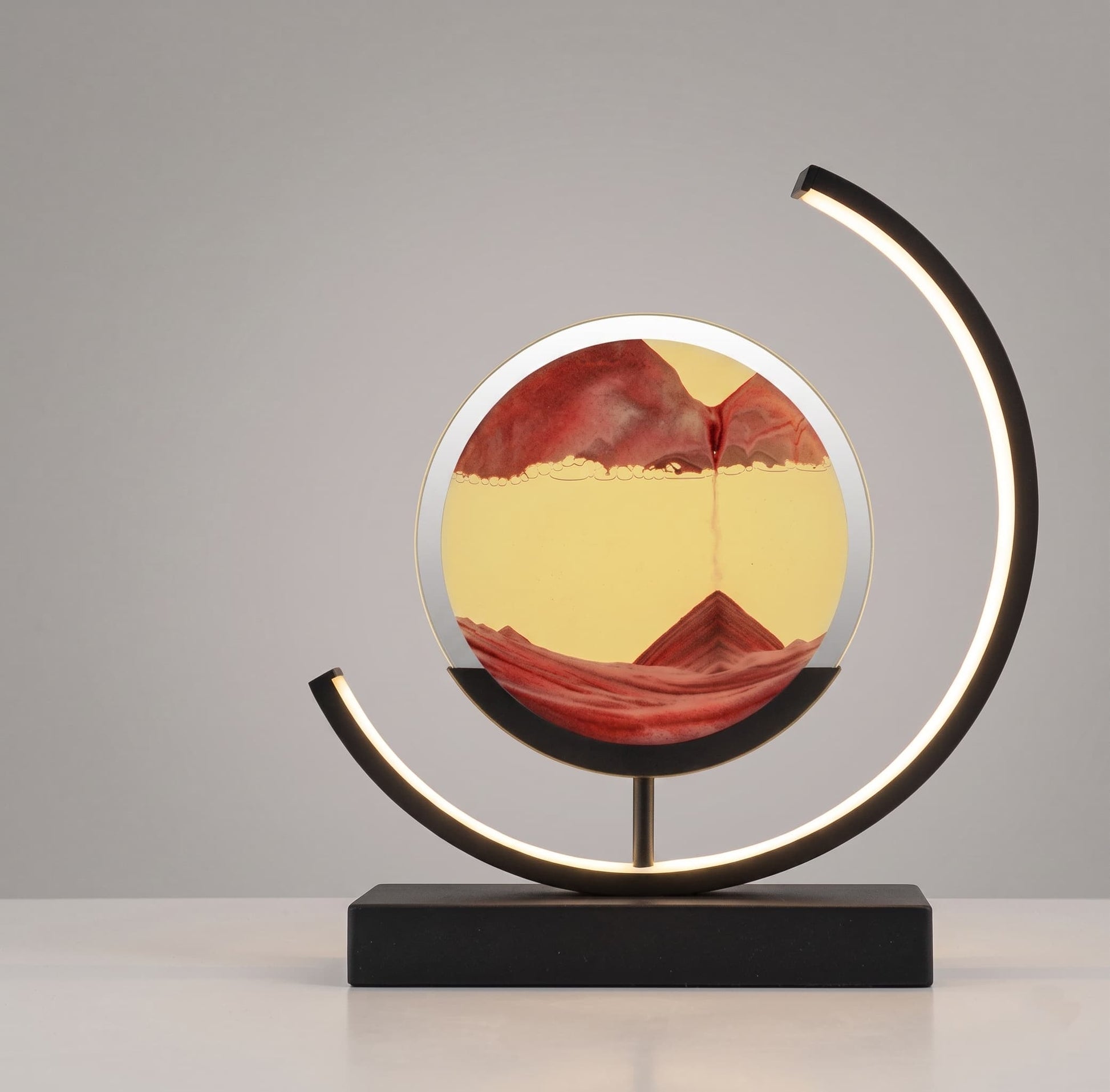 Aesthix Lume Drift quicksand art lamp orange yellow sand black base product shot