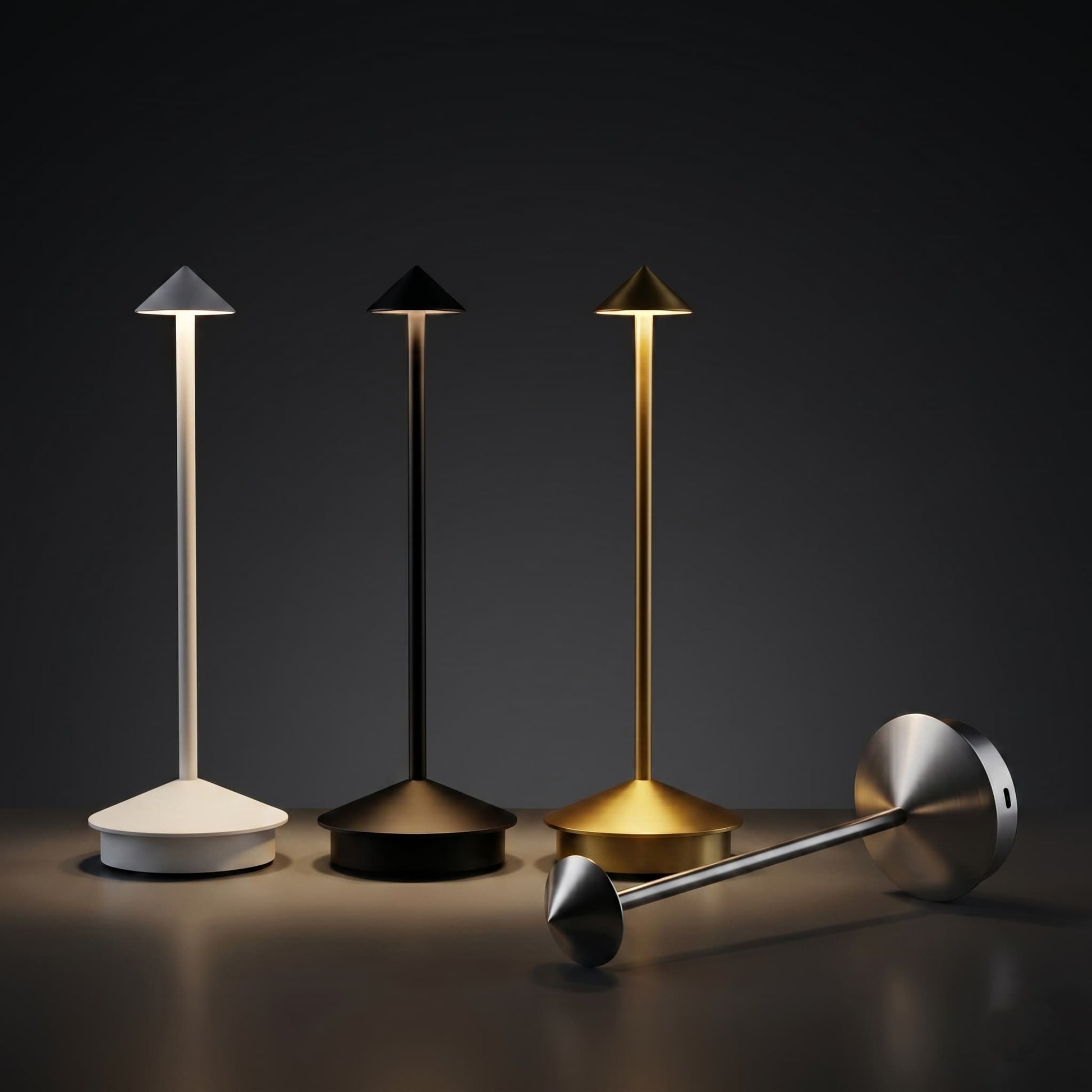 Aesthix Lume Vela slim rechargeable lamp four colour variants white black gold and silver dark background UK