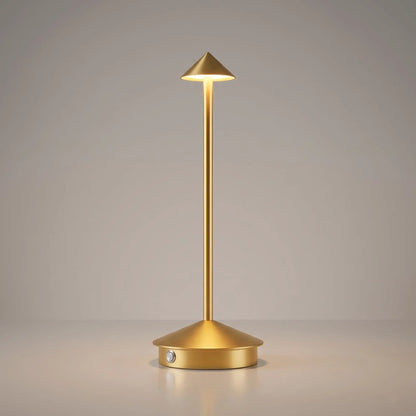 Aesthix Lume Vela slim rechargeable lamp in gold finish on plain background