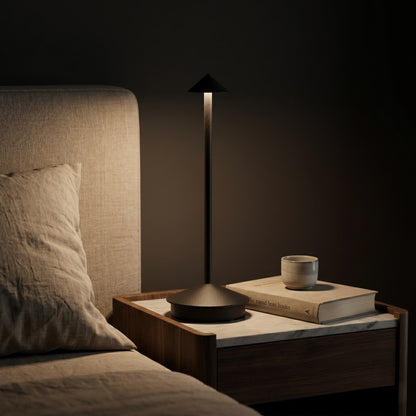 Aesthix Lume Vela slim rechargeable lamp black finish bedside table books dim bedroom warm light UK