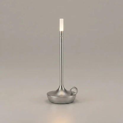 Aesthix Lume Taper candle glow lamp in brushed silver – modern flameless candle design